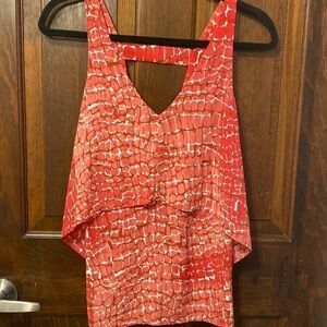 White House Black Market sleeveless red tiered dressy open back blouse. Size XS.